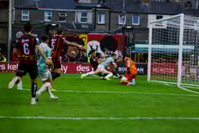 Robbie Benson goes down inside the Bohemians six yard box as he tries to get onto the end of Adam O'Reilly's cross. Photographs by Kevin Moore.