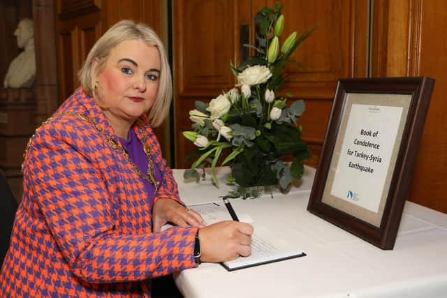 Mayor of Derry City and Strabane District Council Cllr Sandra Duffy pictured opening a Book of Condolence in the Guildhall for the victims of the Earthquake in Turkey and Syria.