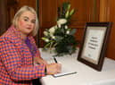 Mayor of Derry City and Strabane District Council Cllr Sandra Duffy pictured opening a Book of Condolence in the Guildhall for the victims of the Earthquake in Turkey and Syria.