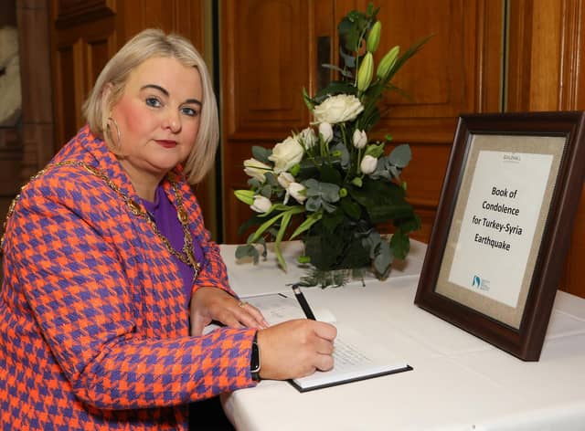 Mayor of Derry City and Strabane District Council Cllr Sandra Duffy pictured opening a Book of Condolence in the Guildhall for the victims of the Earthquake in Turkey and Syria.