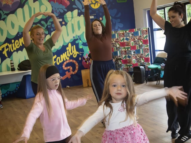 Joining in the fun with the Echo Echo Dancers during Sunday's 'Dance Picnic.' : .