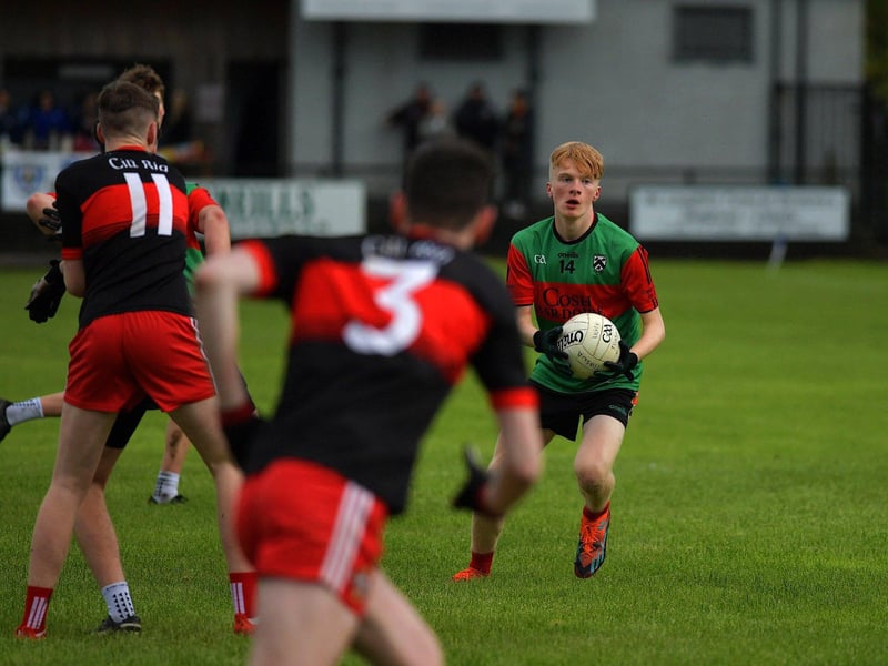 October 2023: Doire Trasna's Liam Wilson surveys his options as Kilrea's Declan Oliver closes in during the Carlin Duffy U17 final won by Kilrea at Claudy. Photo: George Sweeney