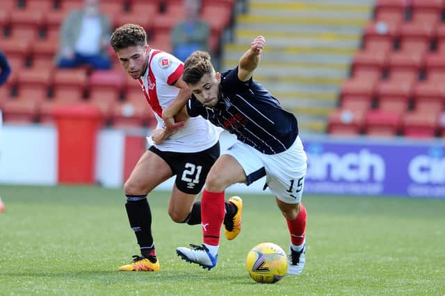 Adam Frizzell (left) pictured playing for Airdrie against Falkirk.