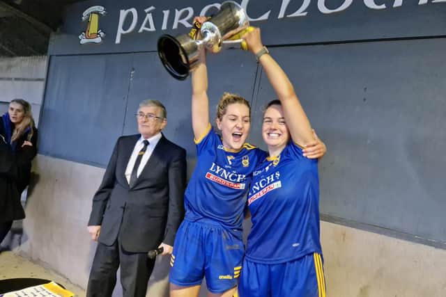 Joint Steelstown captains Aoife McGough and Ciara McGurk lift the trophy after the Brain Ogs' victory over Glenavy at Carrickmore on Saturday.