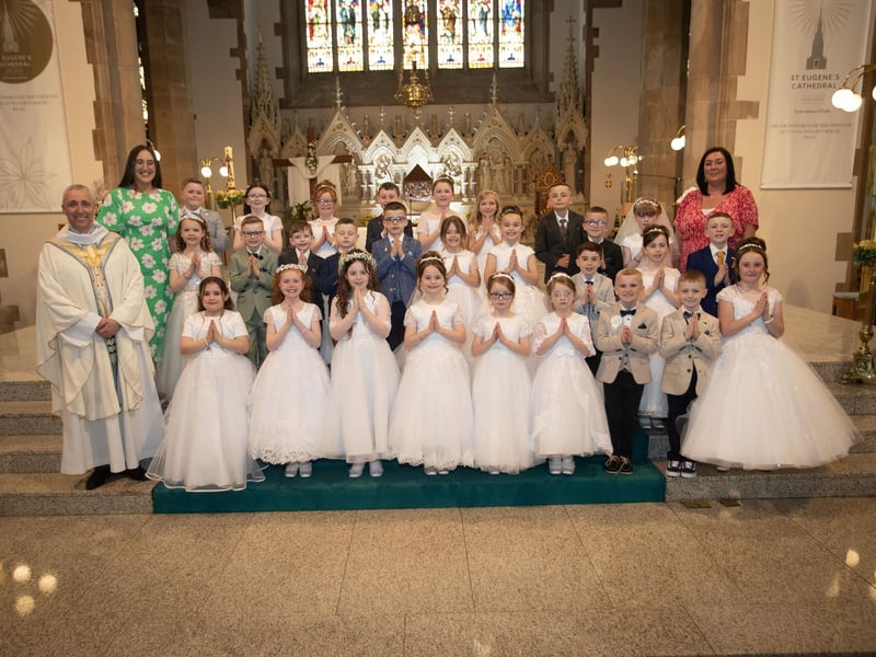Children from Rosemount Primary School who received the Sacrament of First Holy Communion from Fr. Paul Farren at St. Eugene's Cathedral on Friday last. Included are Mrs. Gallagher (teacher) and Miss Rooney. (Photos: Jim McCafferty Photography)