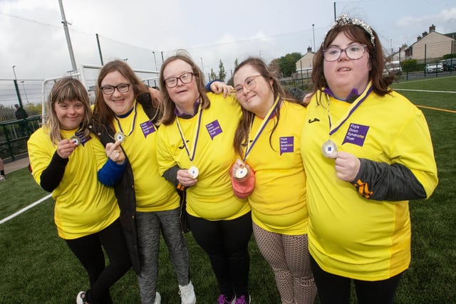 Ladies from the Foyle Down Syndrome Trust team show off their medals.