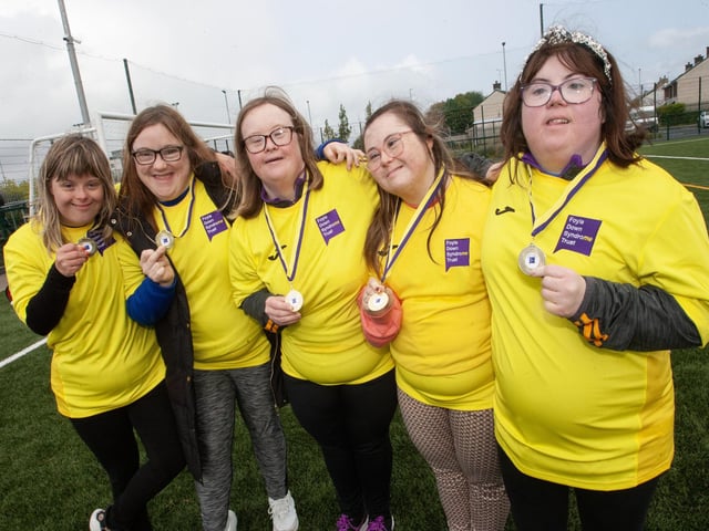 Ladies from the Foyle Down Syndrome Trust team show off their medals.