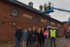 Mayor Sandra Duffy pictured with Destined ‘s Caroline O’Hara (in the Cherry Picker)at the unveiling the new replacement clock at the Foyle Valley Railway Museum on Wednesday afternoon.  Included in the photograph are Destined’s CEO Dermot O’Hara, Project Manager Charlene Keenan, Kevin Cregan of Foyle Builders and Destined members. The replacing of the clock was the final stage in the refurbishment works at the museum.  Photo: George Sweeney. DER2304GS – 21