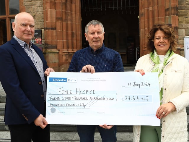 Former Mayor Cllr. Patricia Logue handing over cheque for £27,614.47 to Noel McMonagle (Foyle Hospice). (Photo - Tom Heaney, nwpresspics)