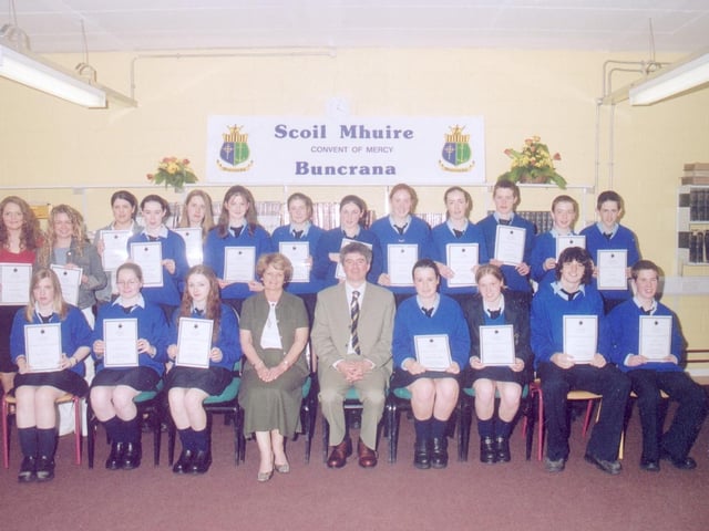 Pupils from Scoil Mhuire who received the best junior and leaving cert results. Included, seated centre, are Mary Margaret Grant, Credit Union sponsors, and Liam Rainey, principal. (2005MG07)