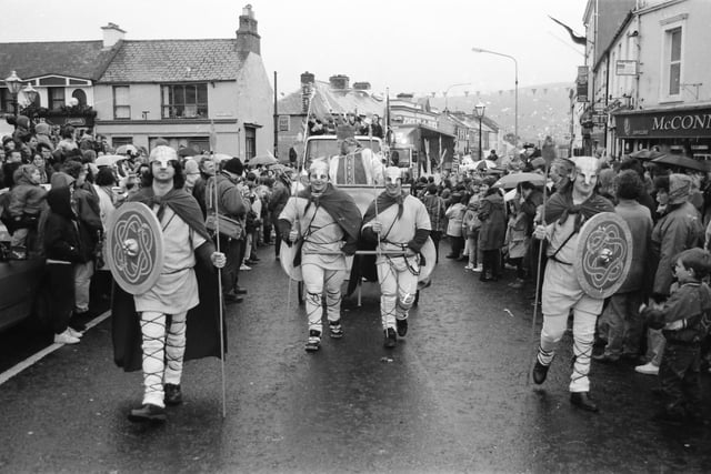 St. Patrick is escorted up Main Street during the 1993 Buncrana St. Patrick's Day parade.