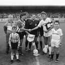 Captains Felix Healy and Steve Bruce shake hands ahead of the clash.