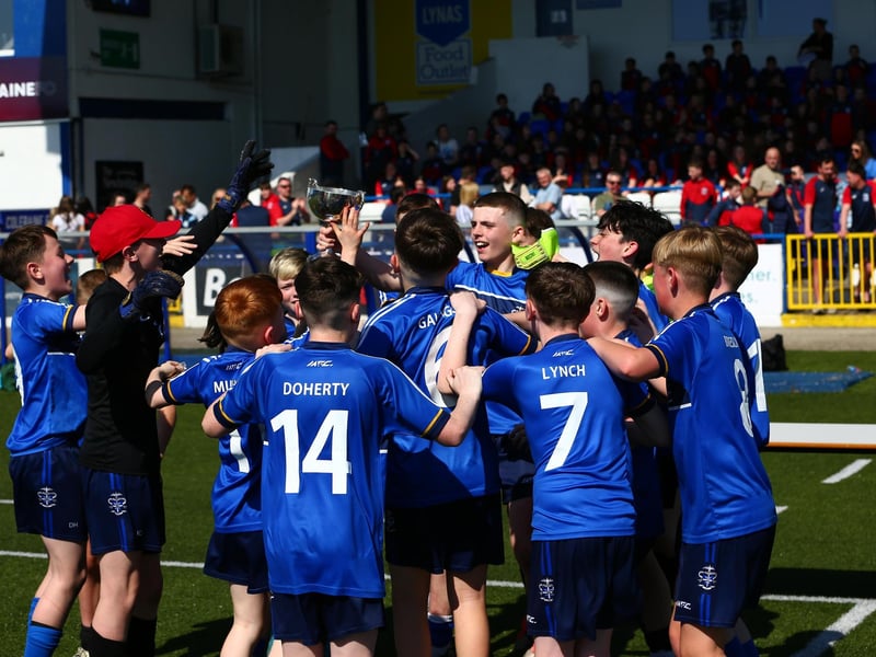CHAMPIONS . . . St Columb's College celebrate a memorable moment at the Showgrounds.