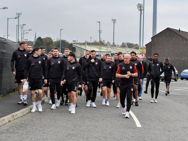 Derry City players and staff on their way to greet fans gathered at Brandywell Stadium on Saturday morning prior to their departure for Dublin ahead of Sunday’s FAI Cup Final against Drogheda United. Photograph: George Sweeney