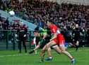 Meath captain Donal McKeogan and Derry’s Shane McGuigan battle for possession during the Allianz Football League game at Owenbeg on Saturday. Photo: George Sweeney. DER2308GS – 54