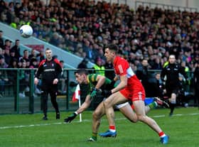 Meath captain Donal McKeogan and Derry’s Shane McGuigan battle for possession during the Allianz Football League game at Owenbeg on Saturday. Photo: George Sweeney. DER2308GS – 54