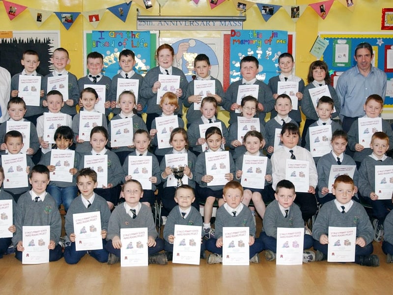 Pupils from St Paul's Primary School, Slievemore, who received Paired Reading certificates. Included are Ms.Lorraine Moore, educational psychologist, WELB, Mr Sean Fleming and Mr Mario Hegarty, teachers.