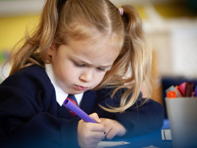 P1 pupil Arlyn working on her numbers.