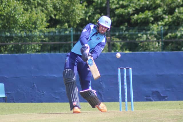 Glendermott's Ben Mills hits a boundary in their game at home to Strabane on Saturday. (Photo: Lawrence Moore)