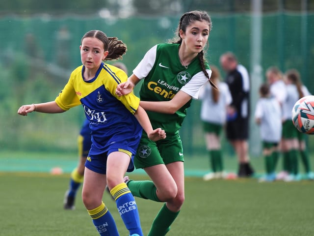 A tussle for the ball during the girls under-13's match between Eglinton Eagles and Crumlin Stars.