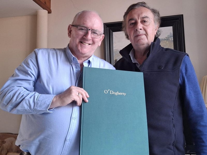 Marcas Ó Murchú with Chieftain Ramón Ó Dogherty and a copy of the Ó Dogherty genealogy.