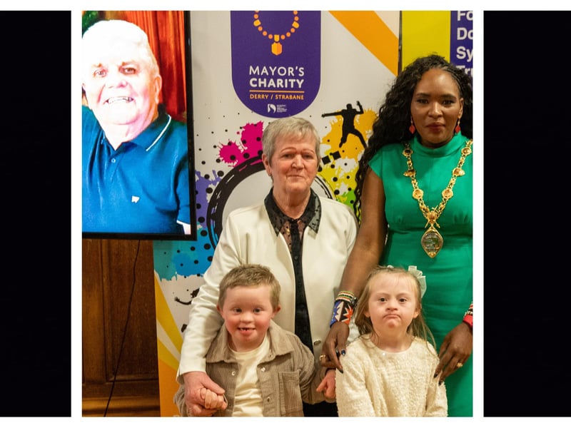 The Mayor Councillor Lilian Seenoi-Barr pictured with Mrs Evelyn Tyre and her grand children, Tiernan and Zara when she hosted a concert in the Guildhall in memory of the late Paddy Tyre in aid of her chosen Mayoral Charity BUD Club and Foyle Down Syndrome Trust. Picture Martin McKeown. 05.12.24