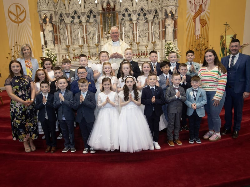 Children from Good Shepherd Primary School who received the Sacrament of First Holy Communion from Fr. Michael Canny at St. Columba's Church, Waterside on Friday last. Included are Mrs. Suzann McCafferty, Principal and Miss Jenny Gillespie and Mr. Brendan Doherty, class teacher. (Photos: Jim McCafferty Photography)