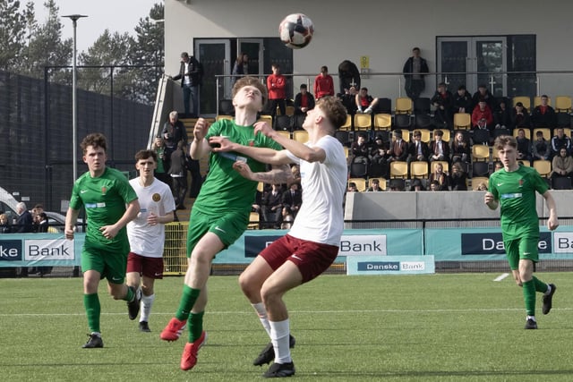 EYES ON THE BALL!. . . . St. Joseph's Callum Deery wins this duel in midfield.