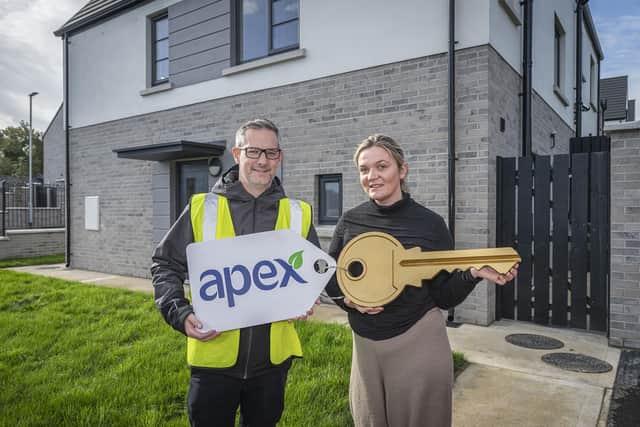 Jennifer Lindsay received the keys to her new home in Maple Glen at The Cashel recently and says it's been life-changing for her family. Pictured with Joe Doherty from Apex Housing Association.