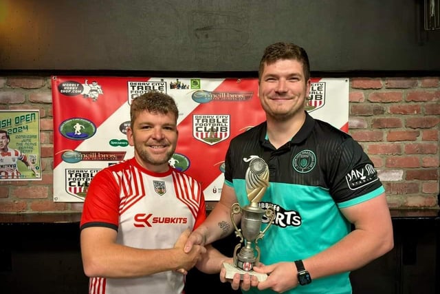 Lawrence Watson, Derry City Table Football Club, presenting the Irish International Open individual trophy to Elliot Bellfontaine.