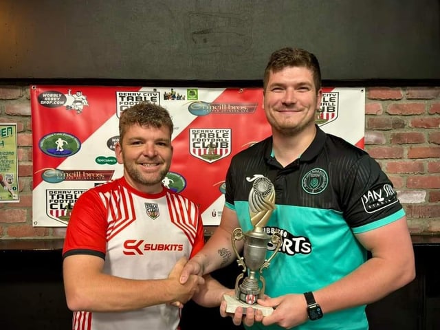 Lawrence Watson, Derry City Table Football Club, presenting the Irish International Open individual trophy to Elliot Bellfontaine.