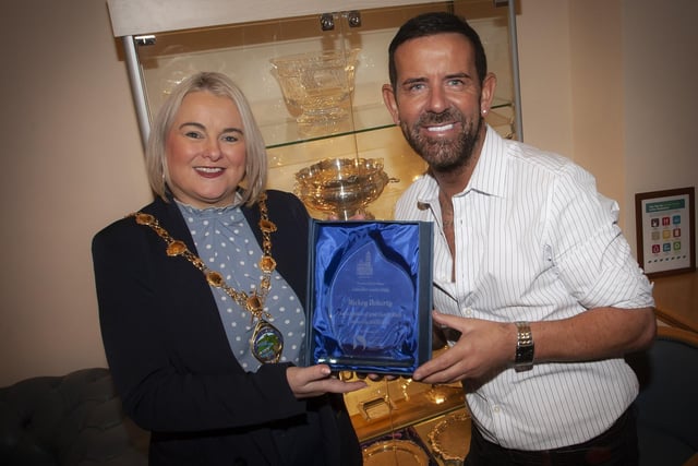 Well known local entertainer Micky Doherty pictured receiving a presentation from the Mayor, Sandra Duffy in recognition of his charity work in the city and district, at a reception in his honour on Thursday evening at the Guildhall. (Photo: Jim McCafferty Photography)