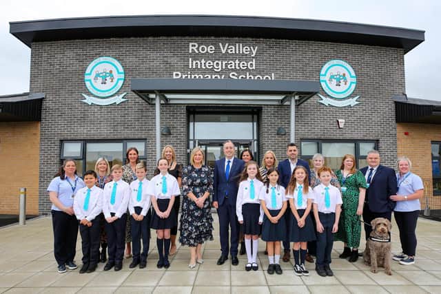Education Minister Paul Givan with staff and pupils. Included are Mrs. Julie McDonagh, principal, and Mr. Ryan Brolly, chairman, Board of Governors. Credit Lorcan Doherty