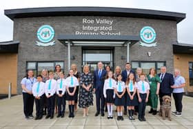 Education Minister Paul Givan with staff and pupils. Included are Mrs. Julie McDonagh, principal, and Mr. Ryan Brolly, chairman, Board of Governors. Credit Lorcan Doherty