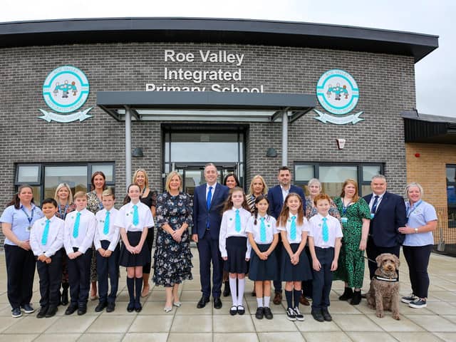 Education Minister Paul Givan with staff and pupils. Included are Mrs. Julie McDonagh, principal, and Mr. Ryan Brolly, chairman, Board of Governors. Credit Lorcan Doherty