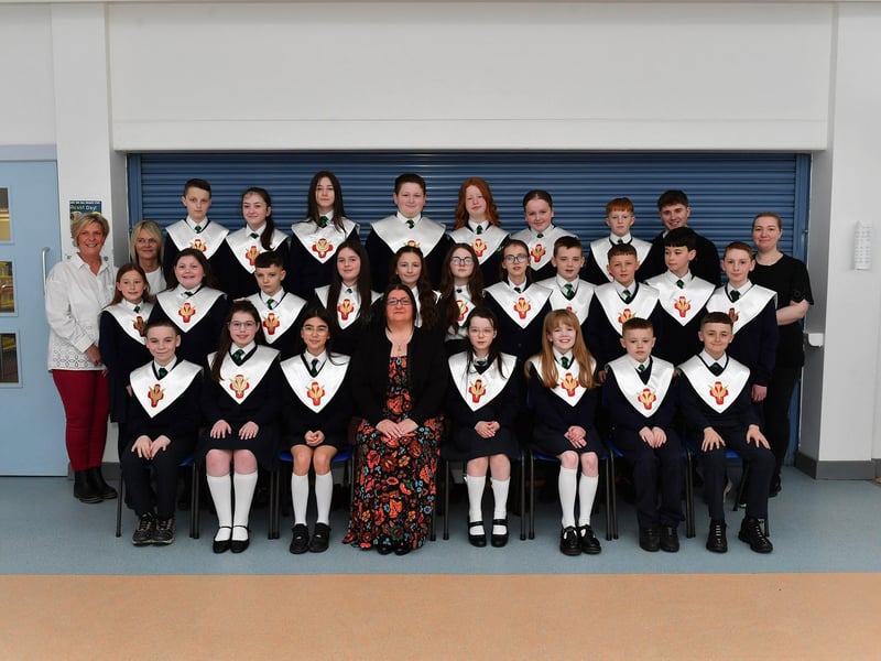 St Patrick’s Primary School teacher Miss R. Doherty (seated) with her P7 class who were confirmed by Fr. D. Mc Grattan in Pennyburn Church on 7th March. Included in the photograph are classroom assistants. Photo: George Sweeney