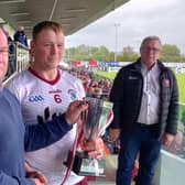 Ballinascreen captain Paul Cleary receives the Derry Intermediate trophy at Owenbeg on Sunday.