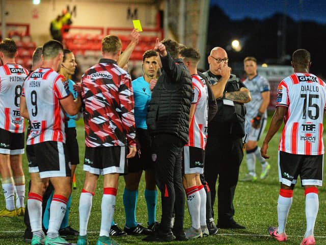 Derry City players crowd around referee Antoine Paul Chiaramonti at the end of the game against FCB Magpies.Photograph: George Sweeney