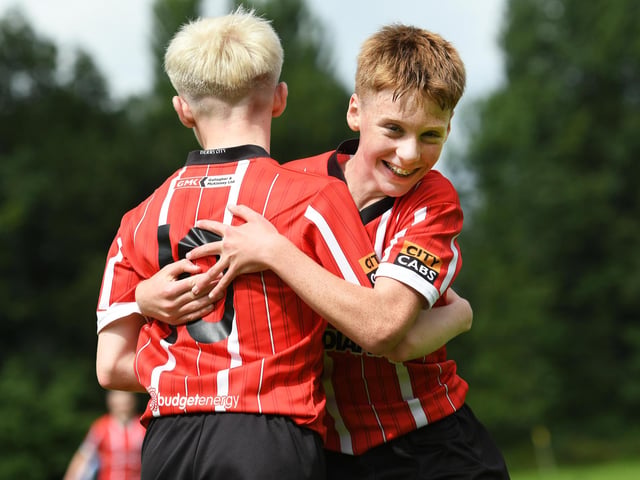 Derry City U14s celebrate a goal.