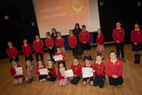 Members from the Students Council and class representatives from Steelstown Primary School proudly show off their new Motto on Friday - 'Learning Today. . . .Leading Tomorrow!' Included is Ms. Neidin Kelly, teacher and Ms. Catherine Doorish, Principal. (Photos: Jim McCafferty Photography)