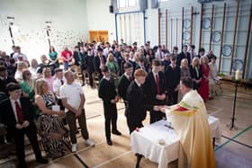 Celebrant Fr. Shaun Doherty accepts candles from Year 12 students during Wednesday's Leavers Mass at St. Joseph's Boys School, Derry. (Photos: Jim McCafferty Photography) : .