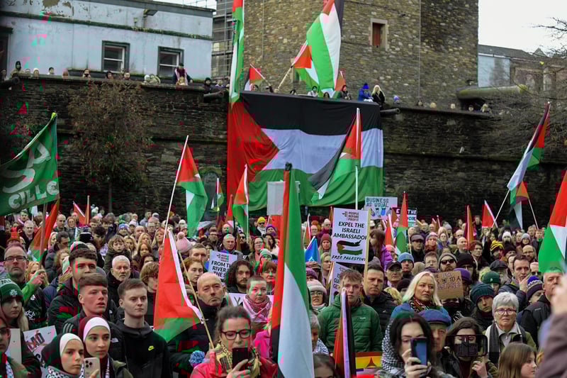 Protestors carry flags and placards during a rally in Guildhall Square, on Saturday afternoon, calling for a ceasefire in Gaza. Photo: George Sweeney