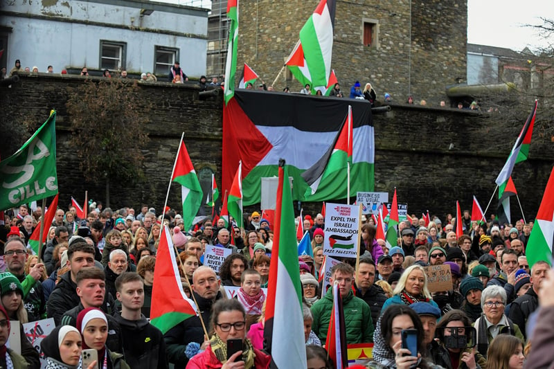 Protestors carry flags and placards during a rally in Guildhall Square, on Saturday afternoon, calling for a ceasefire in Gaza. Photo: George Sweeney