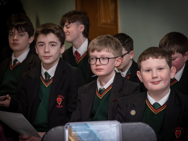 Members of the St. Joseph's School Choir getting ready to perform at Wednesday's 'Grandparents To School' Mass. : .