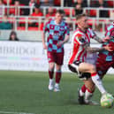 Derry City midfielder Carl Winchester applies the pressure on Drogheda's Shane Farrell.