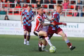 Derry City midfielder Carl Winchester applies the pressure on Drogheda's Shane Farrell.