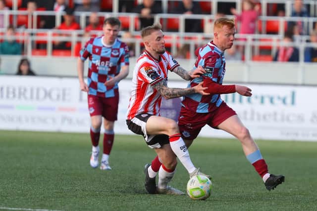 Derry City midfielder Carl Winchester applies the pressure on Drogheda's Shane Farrell.
