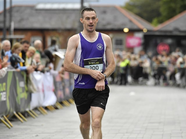 Jonathan Canning, Foyle Valley AC, finishes the 2025 Waterside Half Marathon. Photo: George Sweeney