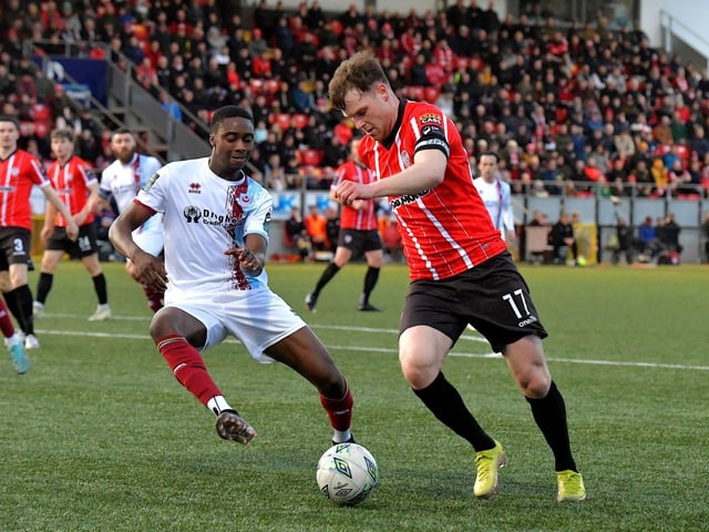 Derry City’s Cameron McJannett is tackled by Elicha Ahul of Drogheda United. Photo: George Sweeney. DER2314GS – 13