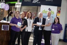 BOOTS CHEQUE FOR DEEDS. . . .Natalie Henry and Rhonda Baldrick, Boots (Foyleside) pictured handing over a cheque for £500 to Deputy Mayor Darren Guy and George McGowan, Project Director, Old Library Trust/DEEDS towards Friday's 'One Stop Shop for Dementia' held in the centre. Included are DEEDS representatives Eilish Brown and Wendy McLaughlin. (Photos: Jim McCafferty Photography)